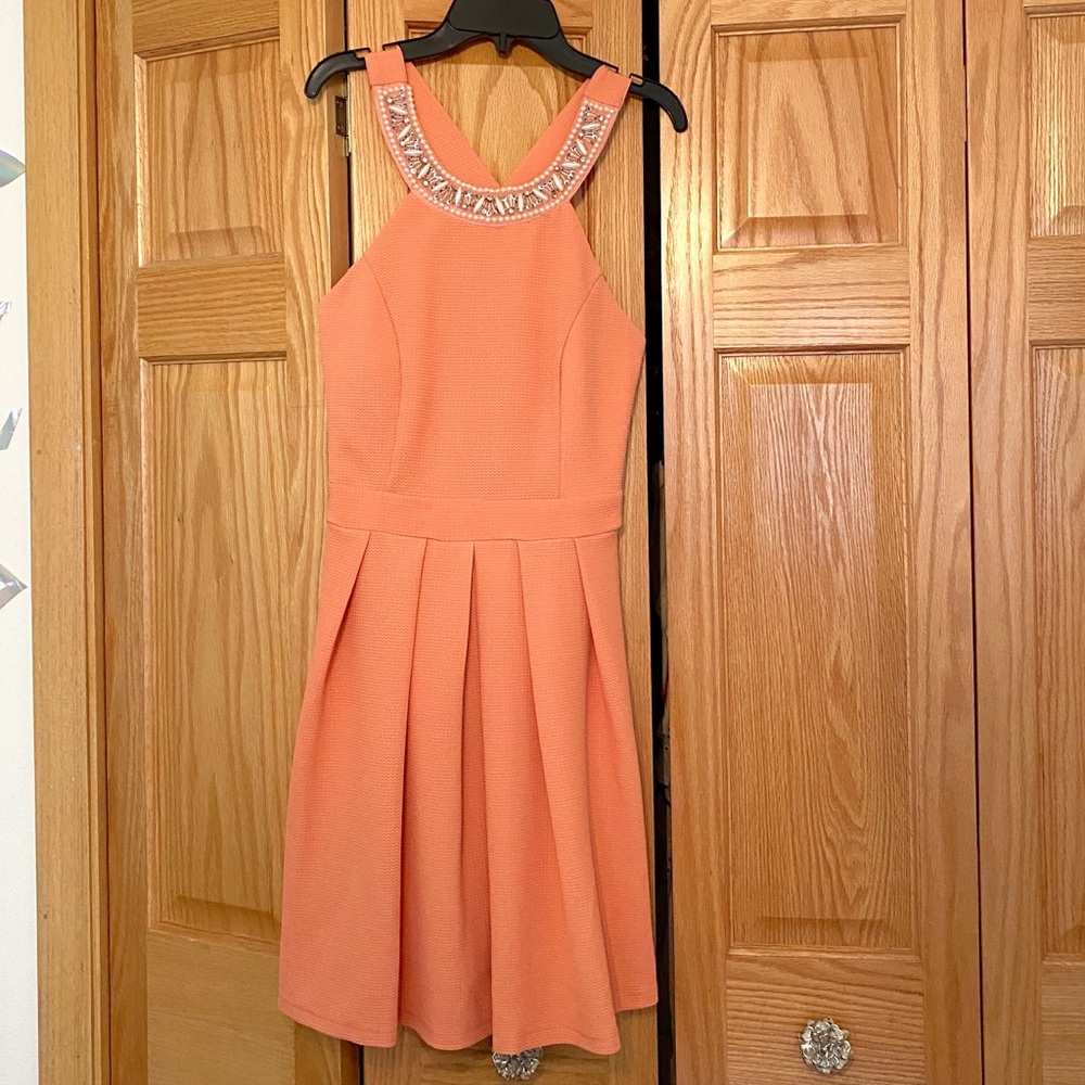Medium coral dress with embellishments